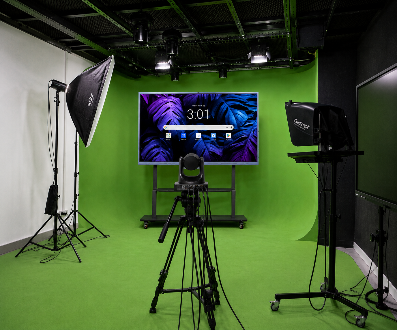 Interactive flat panel mounted on a green screen backdrop with a PTZ camera and teleprompter in an SNL Solutions studio