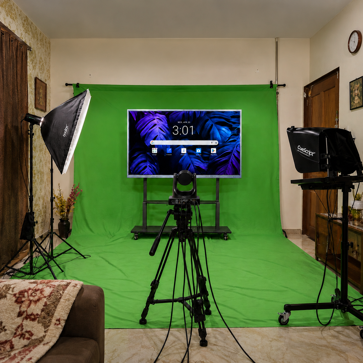 Portable green screen backdrop with an interactive display, PTZ camera, and teleprompter installed on-site